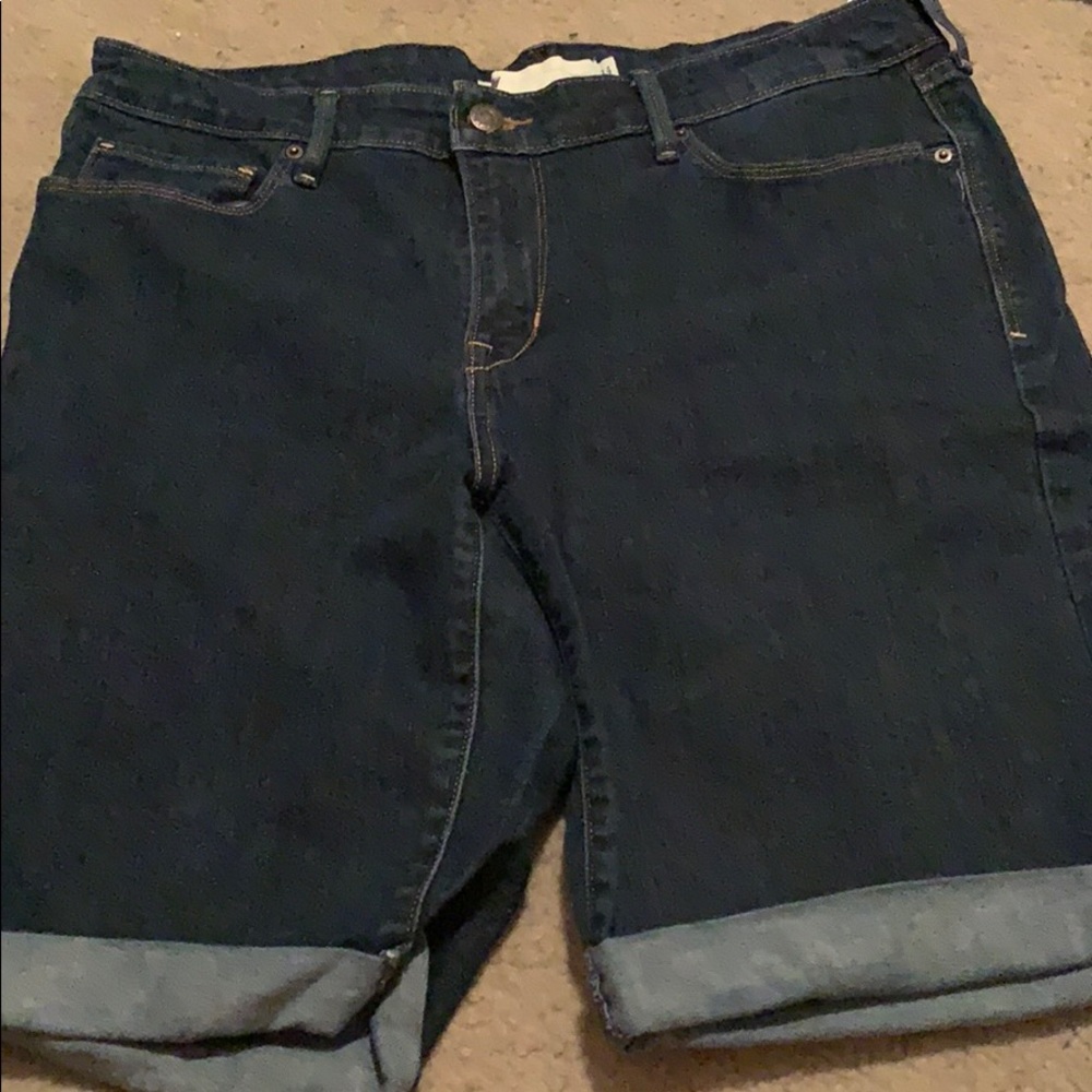 Dark blue jean shorts.